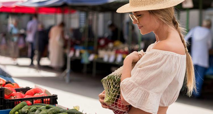 side view woman using organic bag veggies
