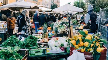 Market, lemons, white umbrellas